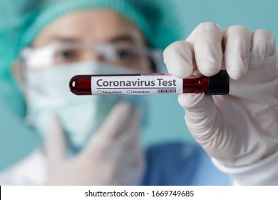 Nurse Holding Testing Patients Blood Samples For Coronavirus Outbreak (COVID-19) In The Laboratory, New Coronavirus 2019-nCoV From Wuhan China Concept