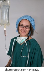 Nurse With IV Bag, Stethoscope And Surgical Mask And Hat