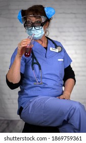 Nurse Karen Wears A Mask On Her Face And In Her Hair While Wearing Multiple Eye Glasses And Drinking Red Fluid From A Test Tube. 