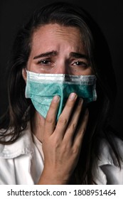 Nurse Looking Sad And Crying With Medical Mask And Black Background