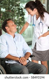 Nurse With Man In Wheelchair