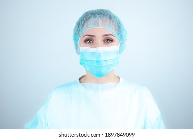 Nurse In A Medical Gown, Mask On A White Background