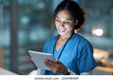 Nurse, medical tablet and black woman in hospital working late on telehealth, research or online consultation. Tech, healthcare or female physician with technology for wellness app in clinic at night - Powered by Shutterstock