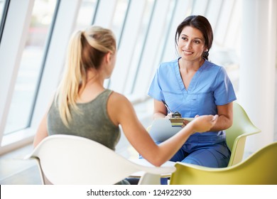 Nurse Meeting With Teenage Girl In Modern Hospital