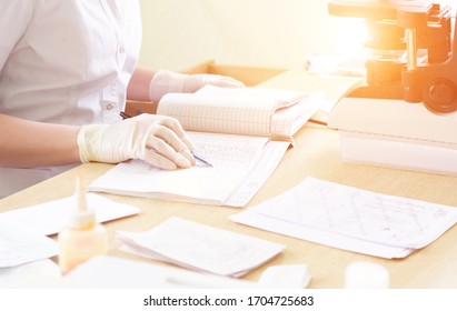 nurse notes in the medical journal the birth rate in the hospital, background. Birth control - Shutterstock ID 1704725683