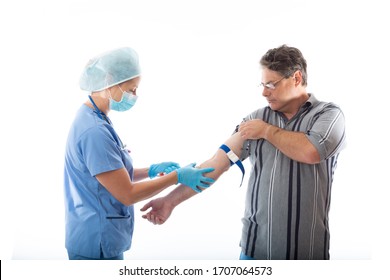 A nurse or pathologist takes blood from a patient for diagnosis