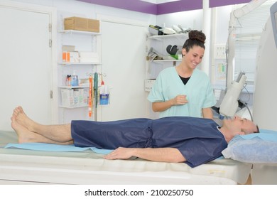 Nurse And Patient Being Diagnosed On Ct Scanner In Hospital