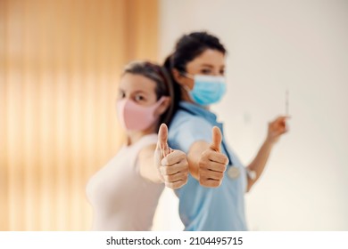 A Nurse And Patient Showing Thumbs Up For A Covid 19 Vaccine. Approval, Vaccination And Treatment.