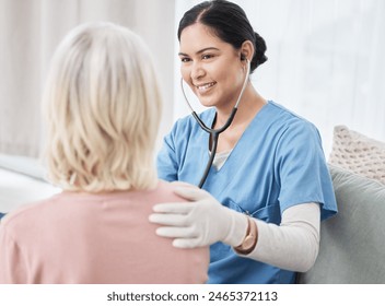 Nurse, patient and stethoscope or heartbeat listening with lung disease consultation, asthma or support. Woman, examination and smile for good news at home visit for checkup, advice or insurance - Powered by Shutterstock