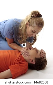 A Nurse Performing Mouth To Mouth Resuscitation To A Child In An Emergency.