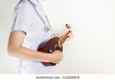 Nurse Playing Ukulele With Copy Space,doctor,Music Therapy Concept