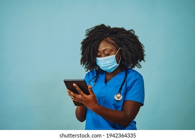 Nurse Practitioner Doctor With Face Mask, Tablet And Stethoscope