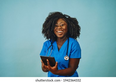 Nurse practitioner doctor with tablet and stethoscope smiling