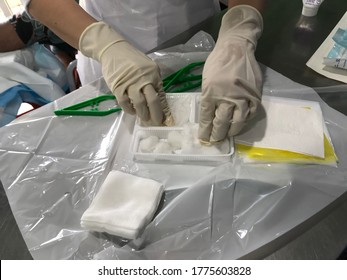 A Nurse Preparing Dressing Tools For Clean Up Patient Wound In The Clinic. 