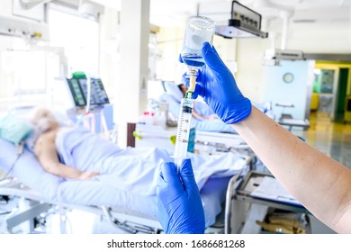 Nurse is preparing intravenous medication in intensive care unit. - Shutterstock ID 1686681268