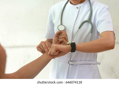 Nurse Pulse Being Taking On A Middle Aged Man's Wrist