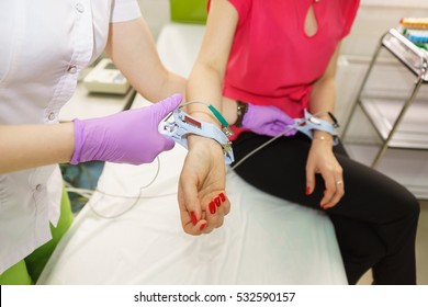 The nurse put the tucks at the wrist of the patient for carrying out electrocardiography