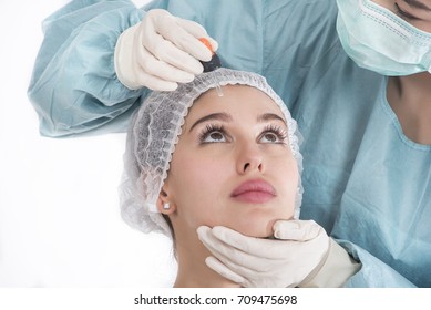 Nurse Putting The Eye Drops To Woman's Eyes