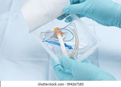 Nurse removes 6mm trachea tube from package.
