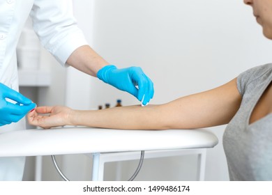 The Nurse Rubs The Hand With Alcohol Before Taking Blood From A Vein For Testing. Disinfects The Place Of Introduction Of A Needle With Antiseptic.