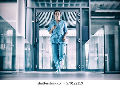 Nurse Running In Hospital Corridor During Emergency