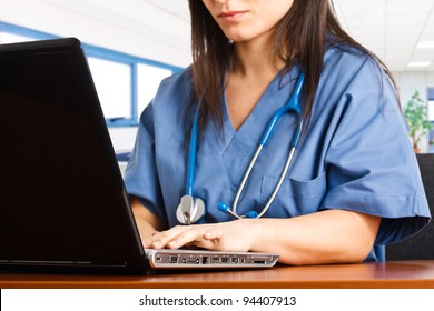 Nurse searching for something using her computer