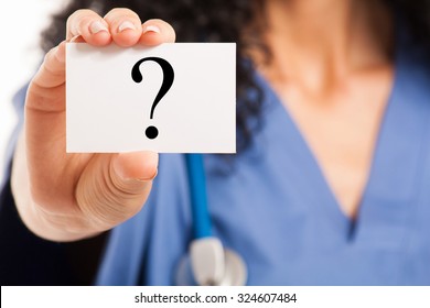 Nurse Showing A Business Card With A Question Mark On It