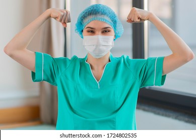 Nurse Showing Muscles And Strenght