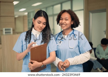 Nurse student Multi-ethnic group of happy nursing students talking medical university corridor.	