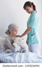 Nurse Supporting Sick Girl With Cancer During Chemotherapy In The Hospital