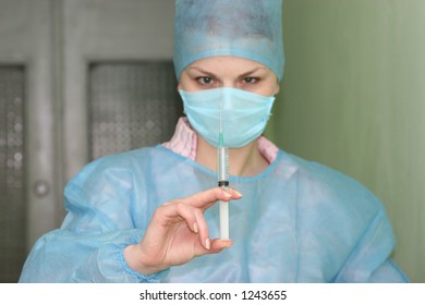 The nurse with a syringe - Shutterstock ID 1243655