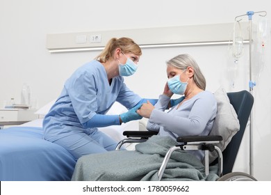 nurse take comfort elderly woman in wheelchair wearing surgical protective medical masks in hospital room, concept of isolation from corona virus covid 19