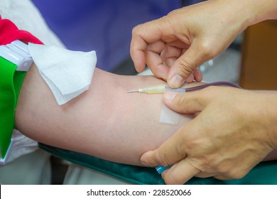 Nurse Taking Blood Draw In Hospital.