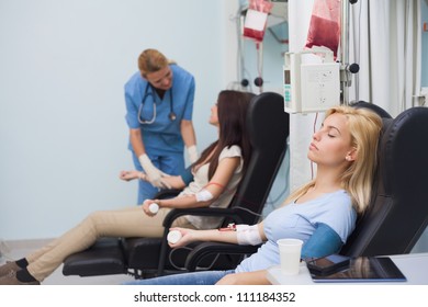 Nurse Taking Care Of A Blood Donor In Hospital Ward, Healthcare Workers In The Coronavirus Covid19 Pandemic