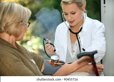 nurse taking care of old lady - Powered by Shutterstock