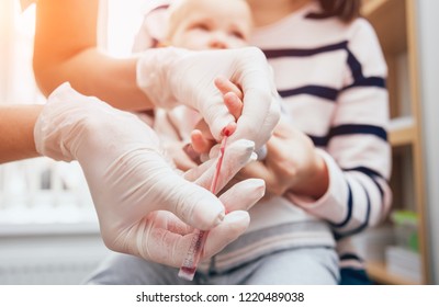 Nurse Taking A Little Child Blood Sample. Medical Equipment. Blood Test