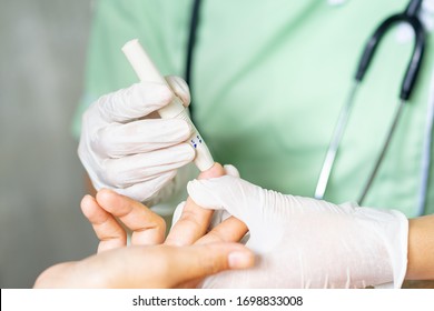 A nurse is taking a patient's blood sample.