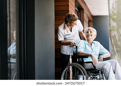 Nurse, talking and senior woman on wheelchair for support or rehabilitation of medical healthcare patient. Happy caregiver, retirement or person with disability at home for recovery, wellness or help - Powered by Shutterstock