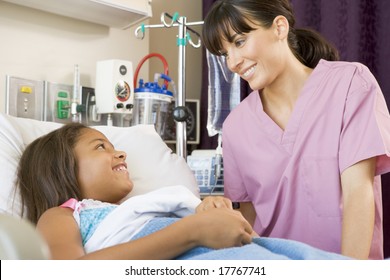 Nurse Talking To Young Patient