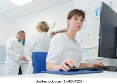 Nurse Typing On Computer Keyboard