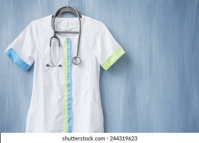 Nurse uniform with stethoscope on hanger
