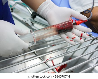 Nurse Use Glass Syringe To Irrigate Nasogastric Tube In Patient With Gastrointestinal Bleeding