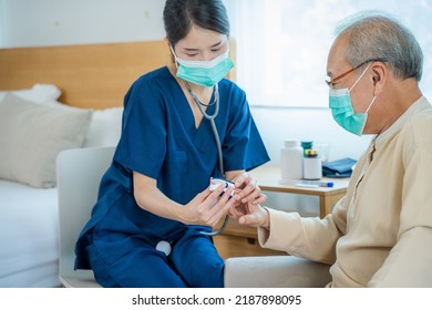 Nurse Use Pulse Oximeter To Measure Senior Man Patient's Blood Oxygen Saturation.