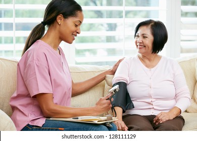 Nurse Visiting Senior Female Patient At Home