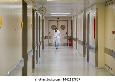 Nurse Walking In Hospital Corridor