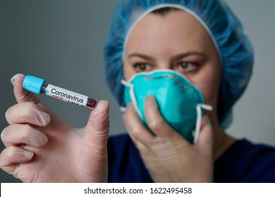 Nurse wearing respirator mask holding a positive blood test result for the new rapidly spreading Coronavirus, originating in Wuhan, China