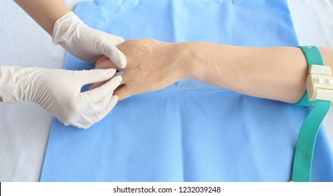 Nurse Wears Gloves Training Injection With Arm Model For Education At Hospital Or School Of Nursing                              