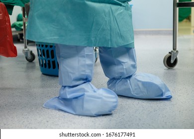 Nurse Wears Water Resistant Disposable Gown And Disposable Shoes Cover In Cardiac Operating Room