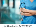 Nurse, woman and arms crossed for cardiology with stethoscope in clinic, support and healthcare. Female person, medical and tool to monitor heart in hospital, medicine and surgeon for treatment