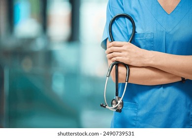 Nurse, woman and arms crossed for cardiology with stethoscope in clinic, support and healthcare. Female person, medical and tool to monitor heart in hospital, medicine and surgeon for treatment